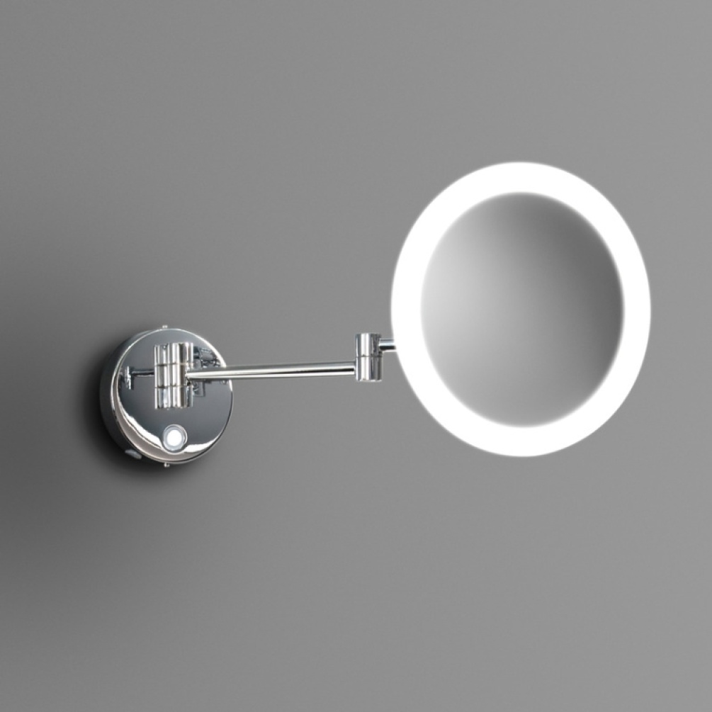 Close up product image of the Origins Living Sloane Round LED Magnifying Mirror emitting cool white light